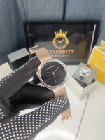 Calvinn Kleinn women, Embossed Dial Mesh Bracelet Watch.. Rose Gold color band, black dial